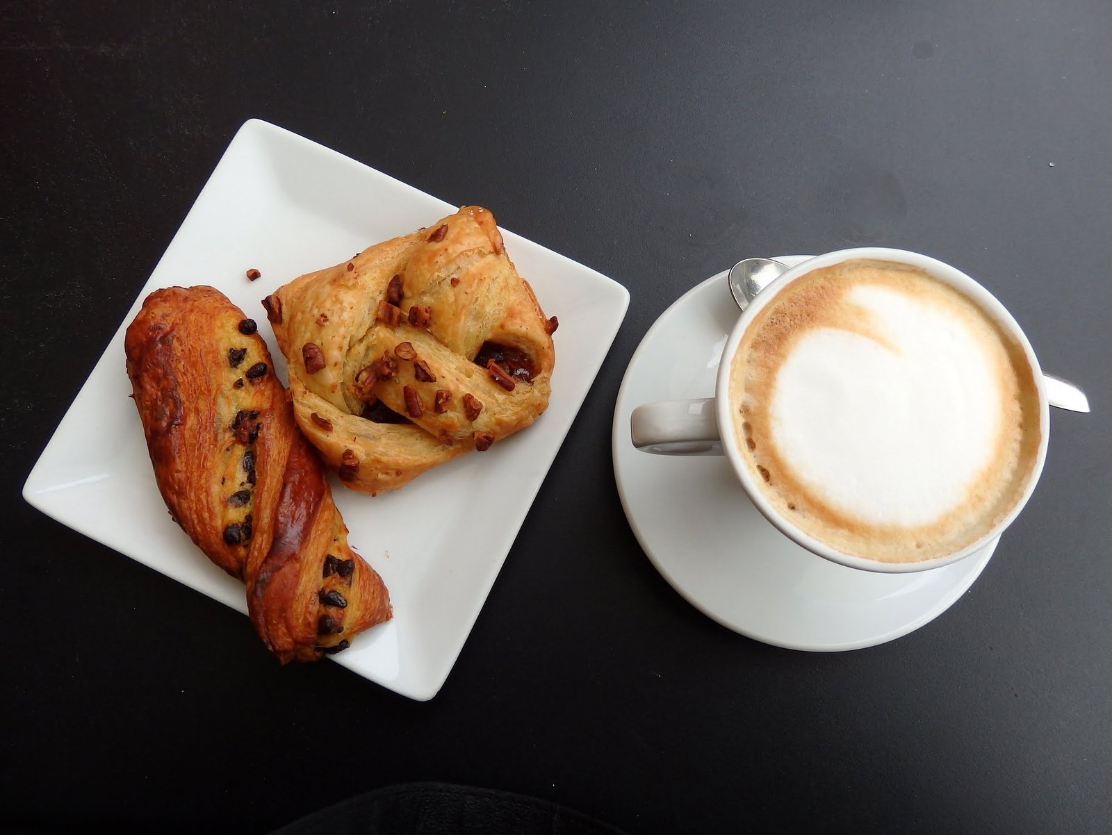 Italian breakfast including cappuccino and pastries in Milan, Italy