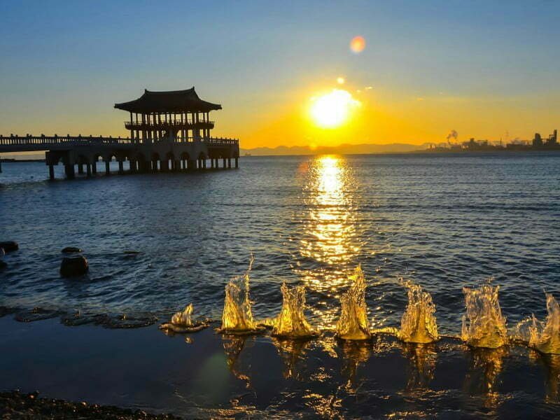 Pohang sunset over the water overlooking a temple in South Korea 