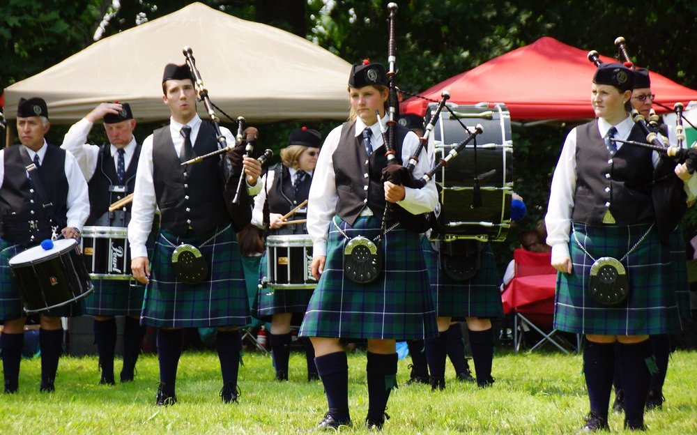 A band of bagpipers taking a rest before playing at the Highland Games in Fredericton, New Brunswick, Canada