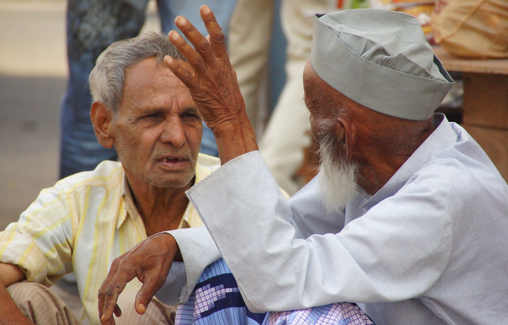 A candid discussion between these two Indian men on the streets of Jaipur, India in the state of Rajasthan