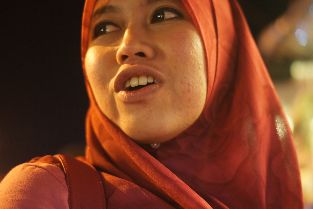 A close-up candid shot of a lady wearing head covering in Melaka, Malaysia