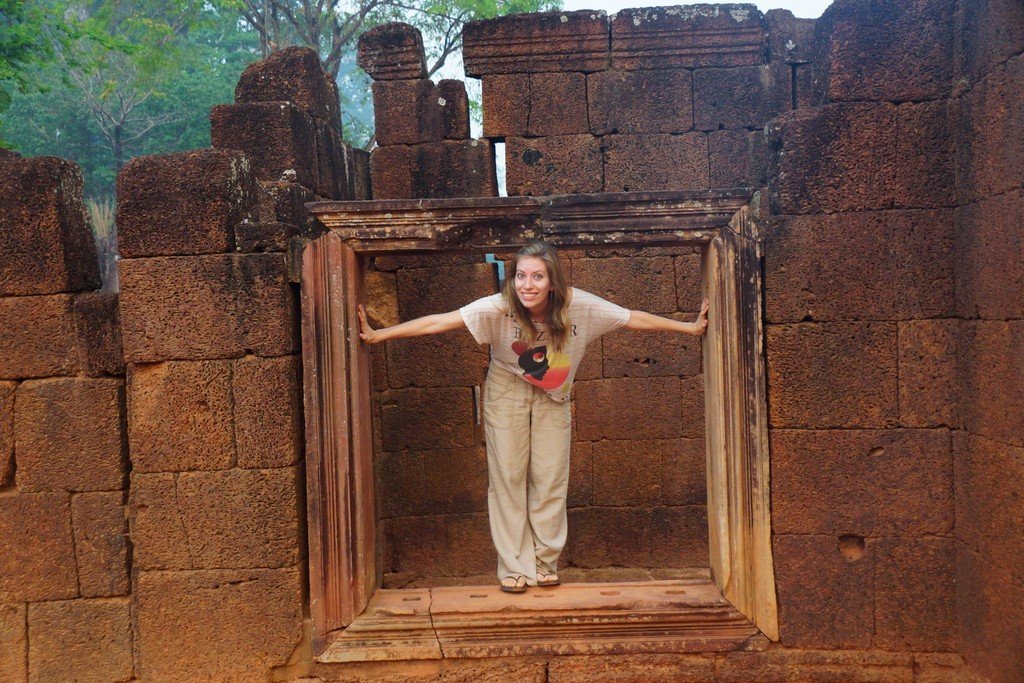 A closer up shot of Audrey in the same window at Banteay Srei in Cambodia 