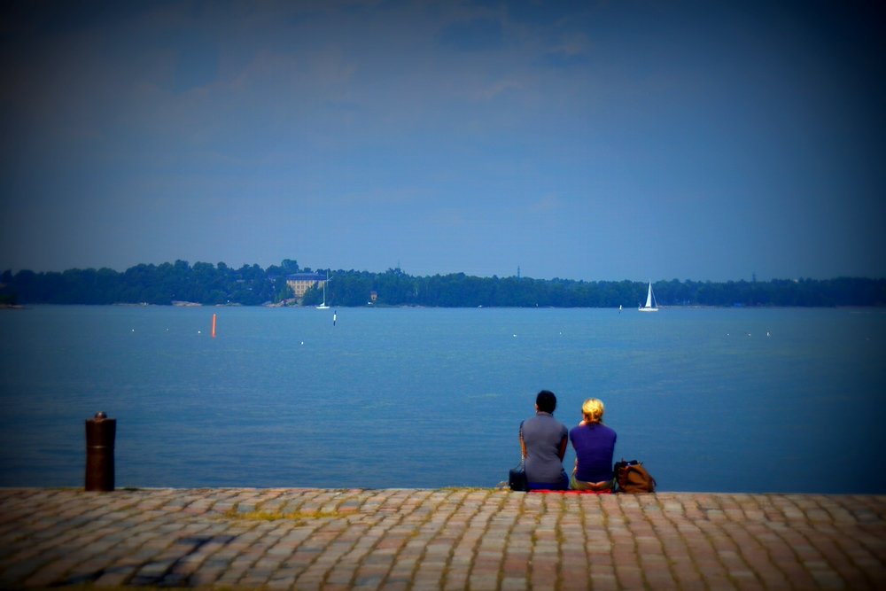 A couple enjoying looking out over the water from Suomenlinna