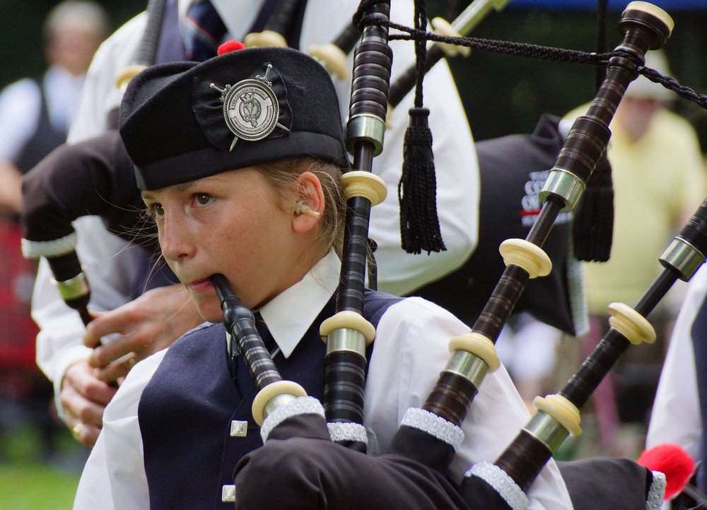 A girl plays the bagpipe at the New Brunswick Games in Fredericton, Canada