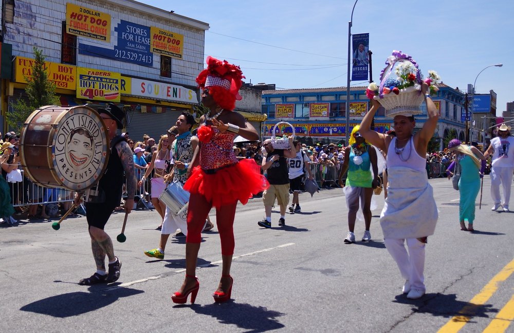 A group of paraders decked out in fancy marine costumes at the Mermaid Parade in Coney Island, New York City