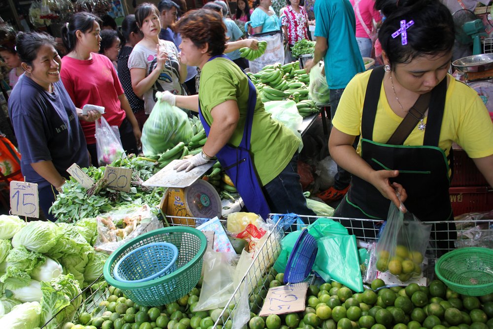 A local Thai market full of hustle and bustle and fresh ingredients to buy to prepare Thai food