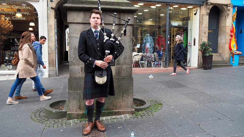 A man playing the bagpipes in Edinburgh, Scotland