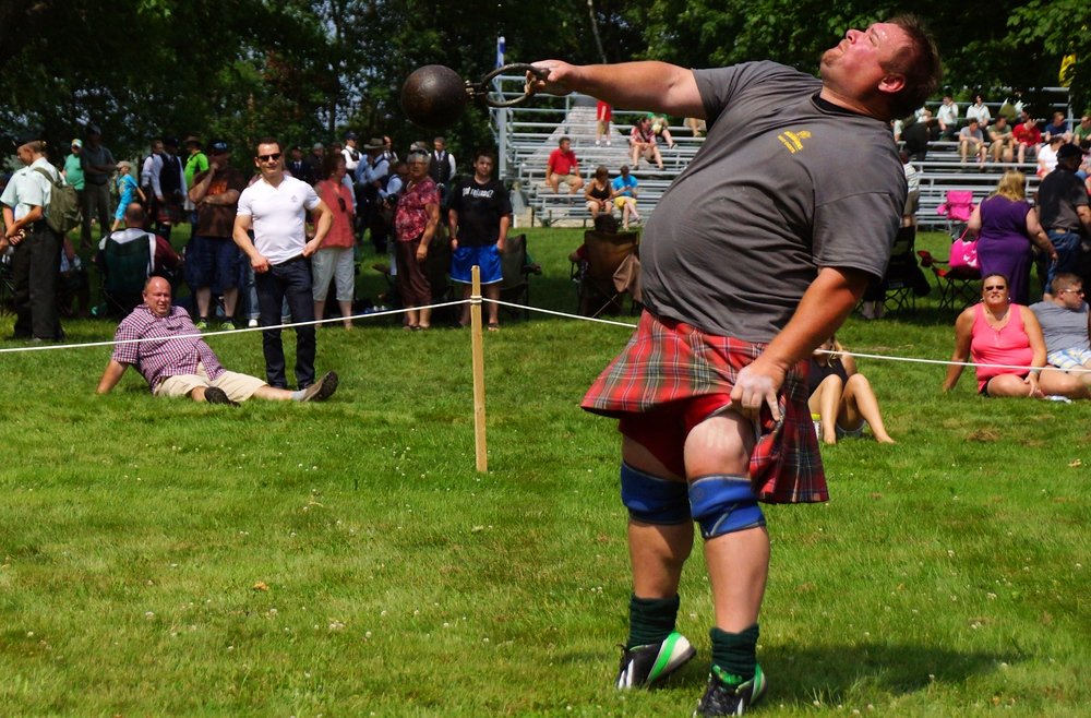 A perspective shot of a man training for the weight over height event at the Highland Games