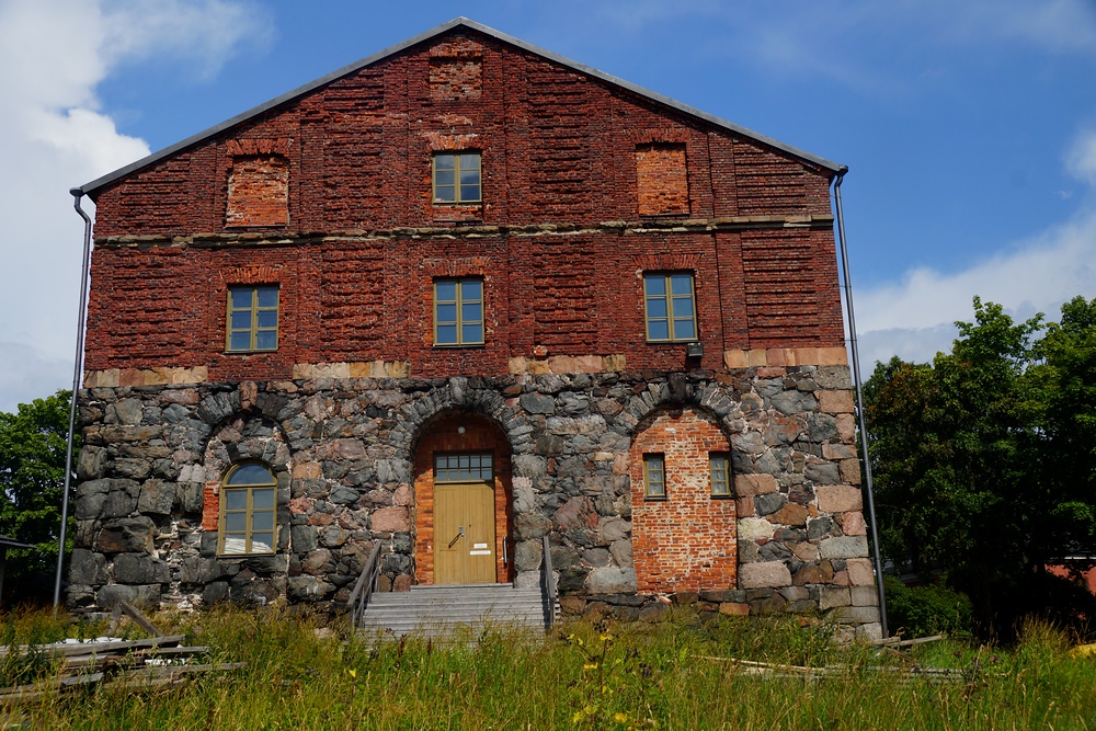 A rustic stone and brick building near the outer edges of Suomenlinna. 