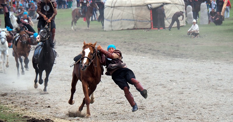 A talented performer doing equestrian tricks at the World Games in Kyrgyzstan