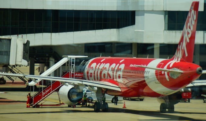 Air Asia plane docked at the gate as we embark on our visa run to Malaysia