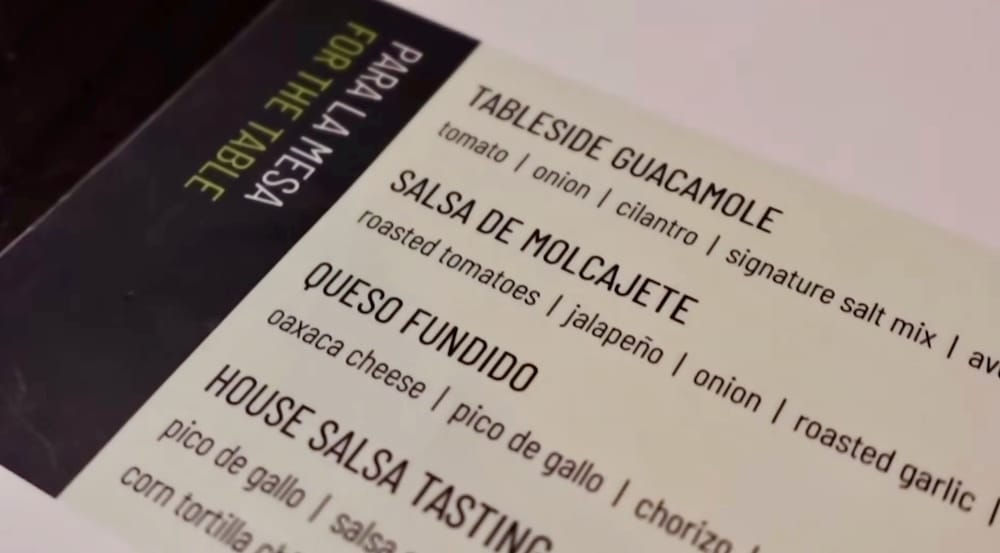 Añejo Banff menu showing House Salsa Tasting, guacamole and Mexican restaurant dishes in Alberta, Canada Close-up of the Añejo menu in Banff, Alberta, Canada, showing items including Tableside Guacamole, Salsa de Molcajete, Queso Fundido and the House Salsa Tasting.