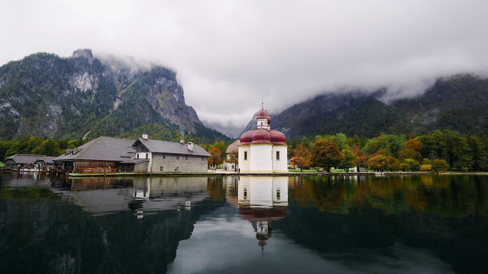 Architecture reflected in the calm lake waters of Berchtesgaden National Park in Germany