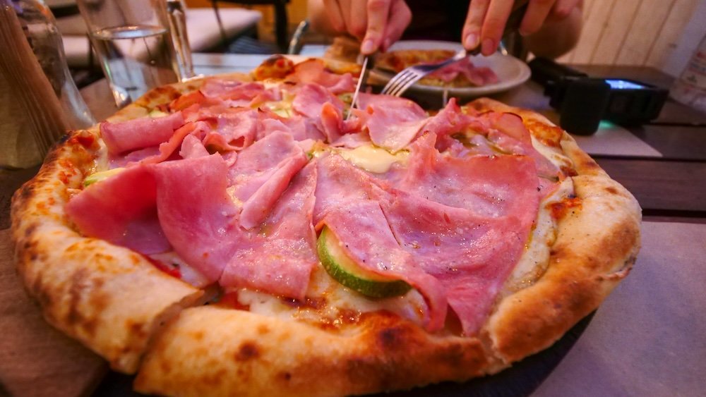 Argentine pizza loaded with meat and other toppings in Cordoba city, Argentina 