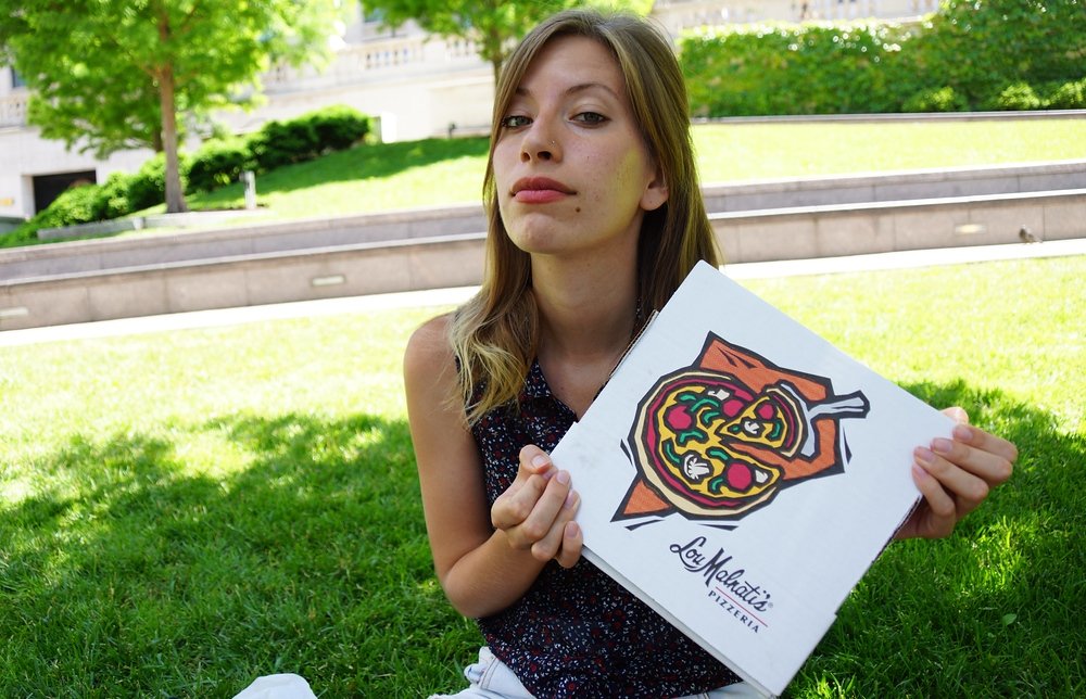 Audrey Bergner of That Backpacker posing with Chicago Deep Dish Pizza from Lou Malnati's