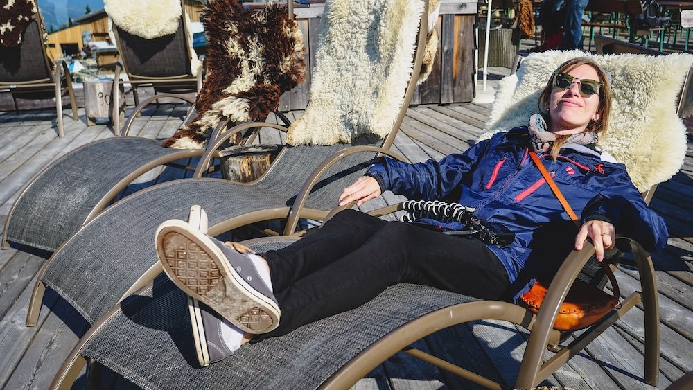 Audrey Bergner That Backpacker enjoying relaxing on a comfortable chair with a Coffee and Mountain Views in Tyrol, Austria 