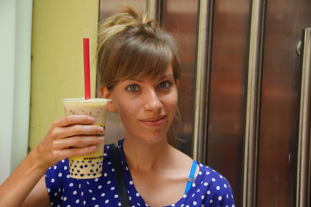 Audrey Bergner That Backpacker holding a refreshing cup of Pearl Milk Tea in her hand in Macau, China