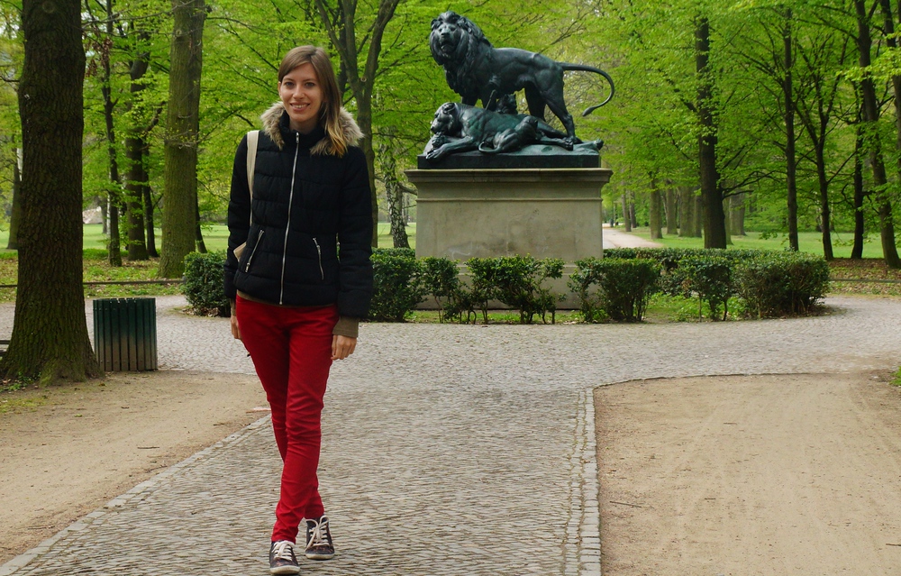 Audrey Bergner That Backpacker posing by the Tiergarten Lion Statue in Berlin, Germany 