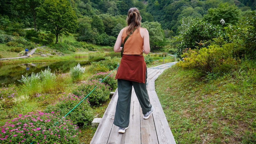 Audrey Bergner That Backpacker walking on a boardwalk in Yuzawa 