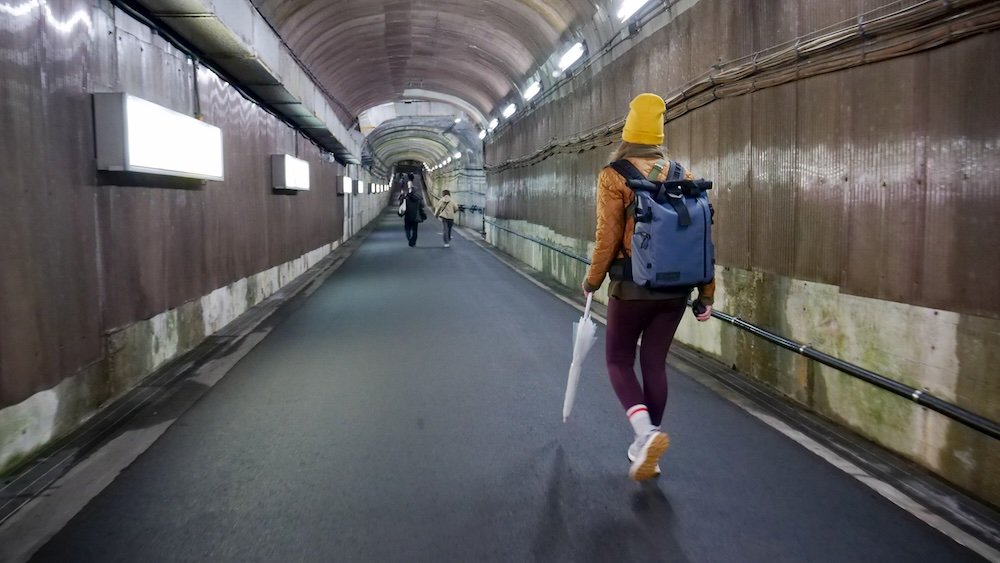 Audrey Bergner That Backpacker walking to reach the Kanden Tunnel Electric Bus traveling from Kurobe Dam to Ogizawa Station 