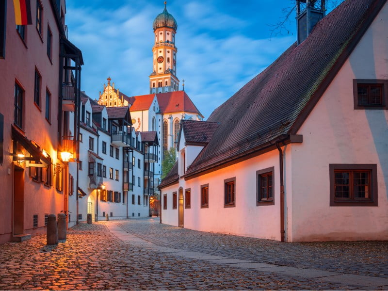 Augsburg traditional architecture in Germany with the city lights on at night 