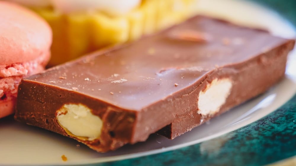 Bariloche artisan chocolate dessert showcasing northern Patagonia sweet food culture Bariloche Patagonia Argentina artisan chocolate close-up with creamy filling and dessert details, highlighting the region’s famous chocolate culture in northern Patagonia where Swiss-inspired sweets define the local food experience