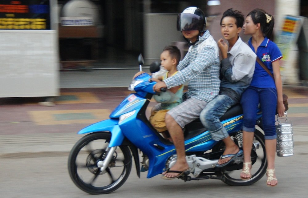 Battambang family of four on a scouter in Cambodia 