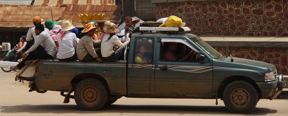 Battambang locals packed on the back of a truck in Cambodia 