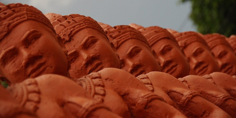 Battambang statues lined up in a row 