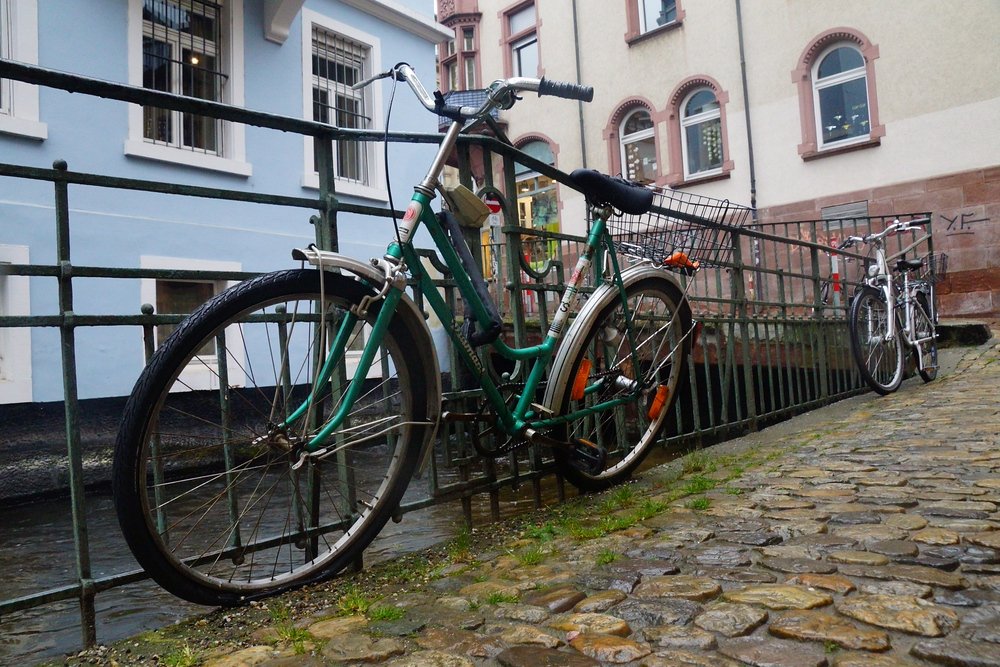 Bicycles parked alongside the canal like other cities I've visited in Germany Freiburg is very pedestrian and bicycle friendly