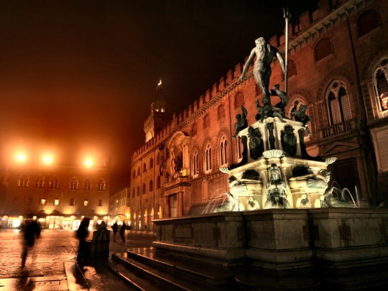 Bologna fountain at night in Italy 
