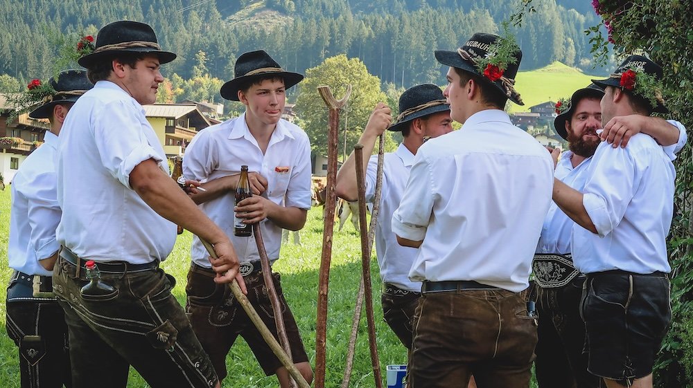 Boys in the local Tyrol attire gathered in a circle 