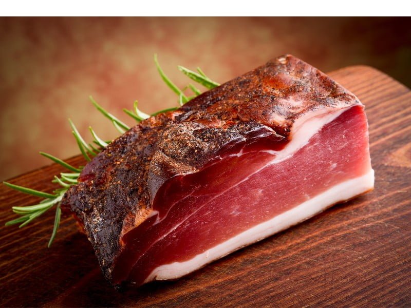 Bolzano in Italy is known for its Italian cuisine such as Speck which is cured meat 