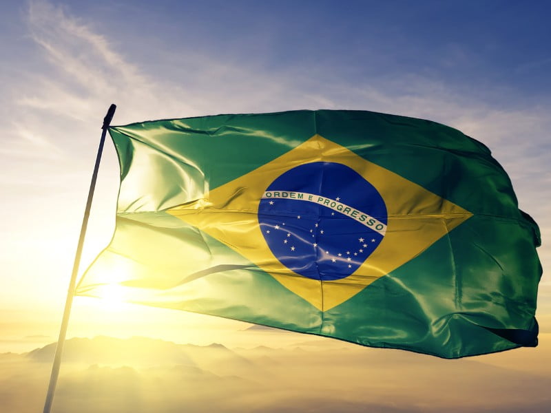Brazil flag with epic sunset in the background 