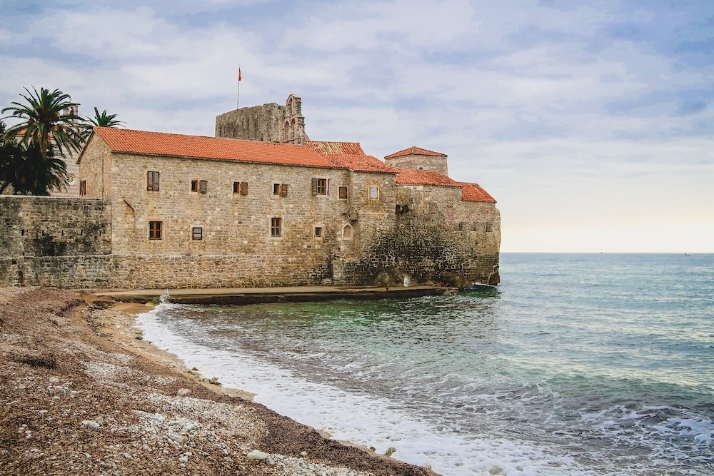 Budva beach and historic building views in Montenegro 