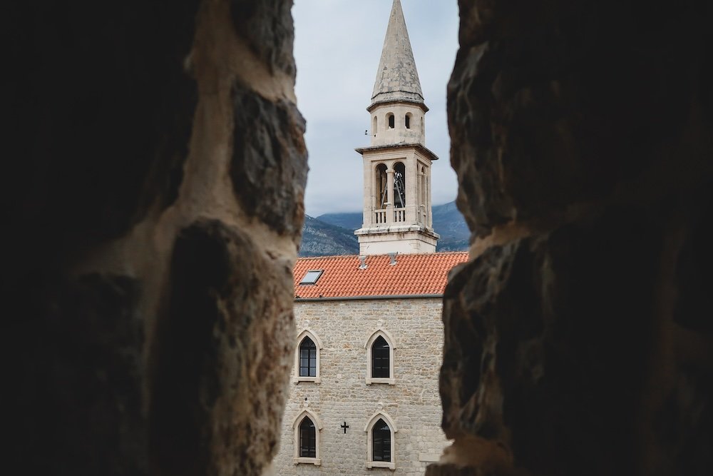 Budva cathedral framed by rocks 