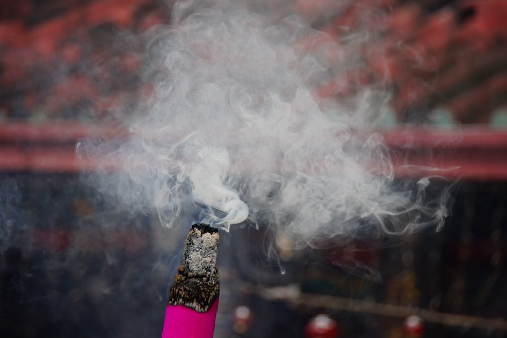 Burning incense at a temple in Georgetown, Penang, Malaysia