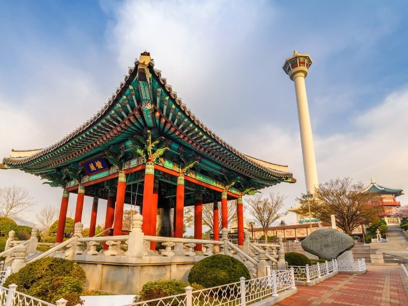 Busan Yongdusan Park in South Korea featuring a traditional pagoda and tower in the background 