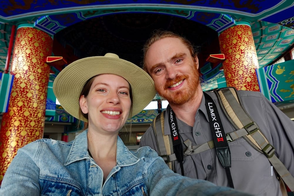 Samuel Jeffery and Audrey Bergner at the Chinese Cultural Centre in Calgary Chinatown, Alberta, Canada Samuel Jeffery and Audrey Bergner pose together in Calgary’s Chinatown, Alberta, Canada, beneath the colourful painted interior of the Chinese Cultural Centre.
