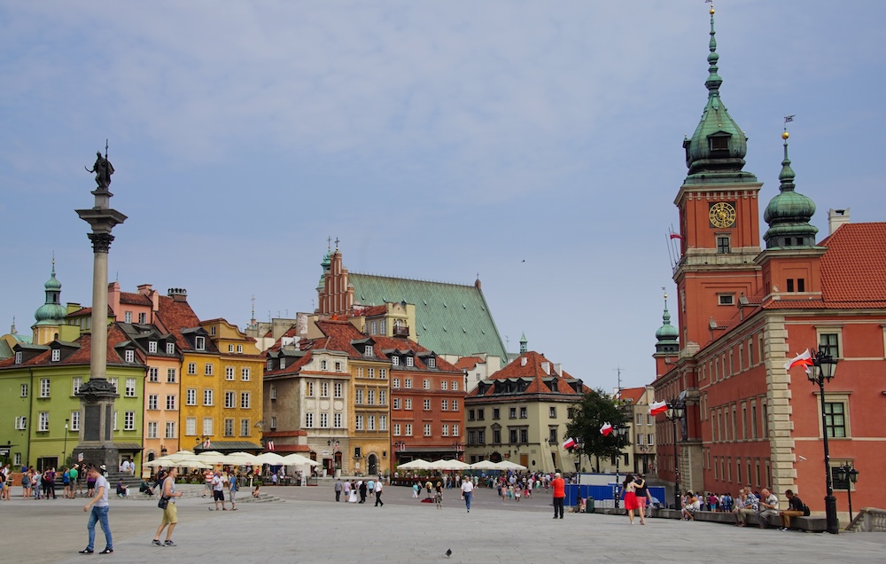 Castle Square with pedestrians and tourists walking in Warsaw, Poland – plac Zamkowy
