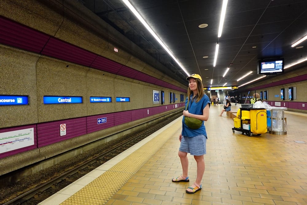 Audrey Bergner at Central LRT Station in downtown Edmonton, Alberta, Canada Audrey Bergner stands on the platform at Central LRT Station in downtown Edmonton, Alberta, Canada, beside the tracks, station signs and tiled transit concourse.