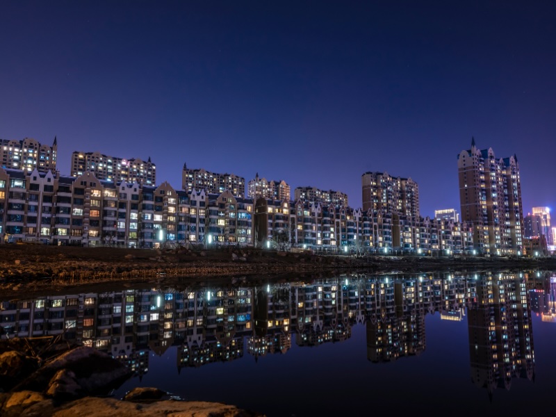 Changchun modern buildings at night reflected in the water 