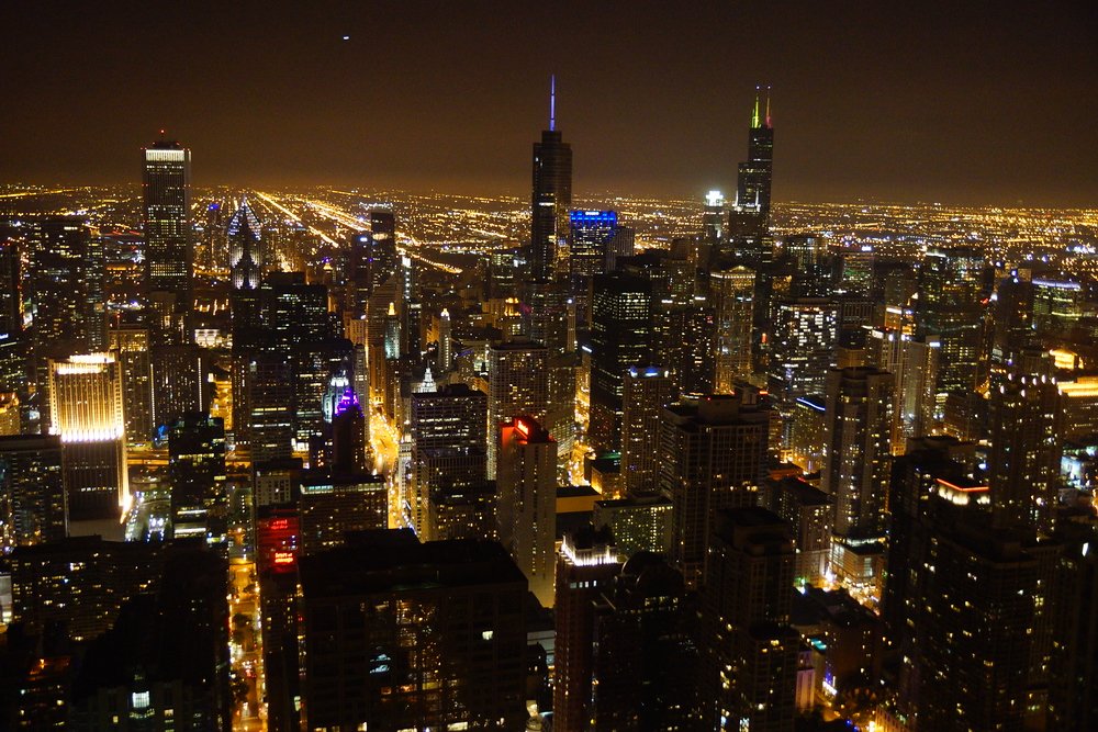 Chicago skyline at night from the Hancock Center with picture perfect views of the downtown architecture 