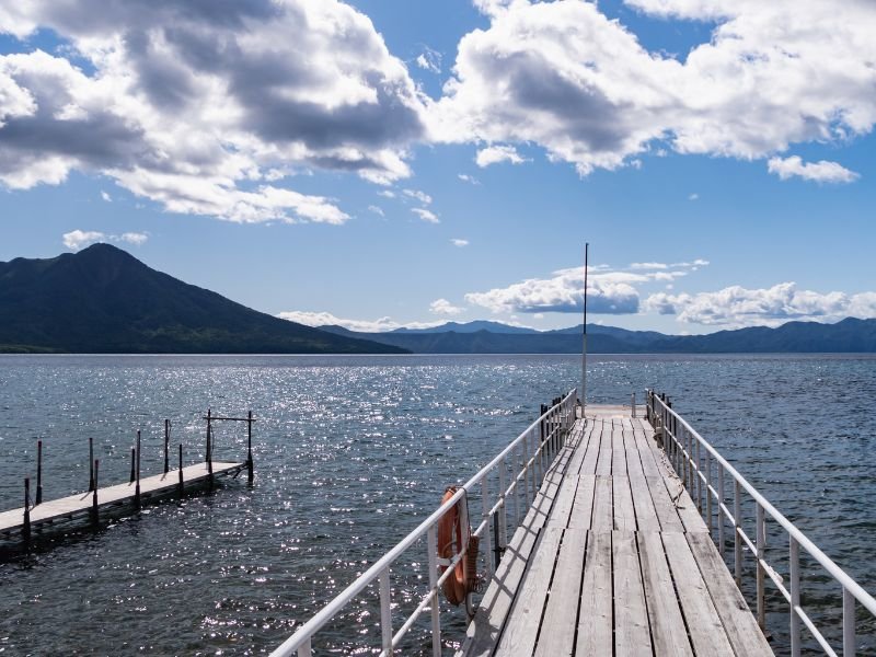 Chitose City with Lake Shikotsu views from a dock in Hokkaido, Japan