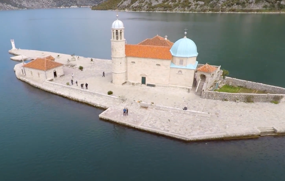 Church of Our Lady of the Rocks Chiesa della Madonna dello Scarpello from a distinct high drone vantage point whilst visiting Perast, Montenegro 