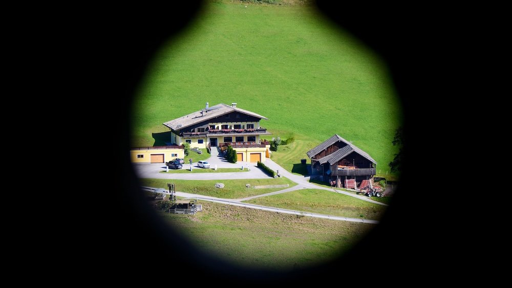 Circular silhouette focus on traditional Austrian buildings in Werfen, Austria 