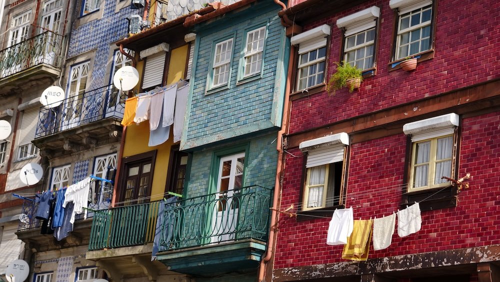 Colourful buildings in Porto, Portugal macro details with laundry hanging outside 