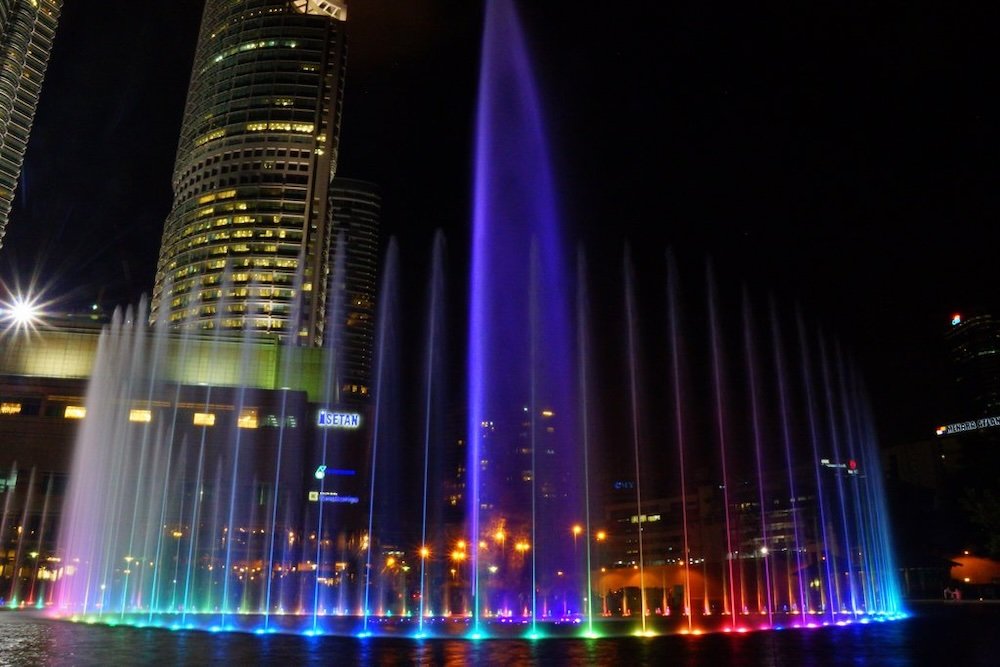 Colorful water display outside the Petronas Towers in Kuala Lumpur, Malaysia 