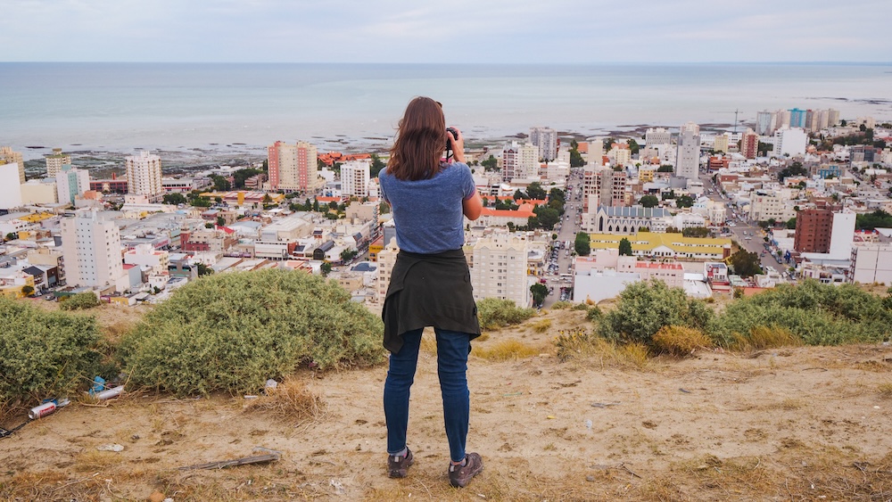 Comodoro Rivadavia Patagonia city view overlooking the Atlantic coast with Audrey Bergner Comodoro Rivadavia city panorama from a hillside viewpoint in Patagonia Argentina where Audrey Bergner photographs the coastal skyline overlooking the Atlantic Ocean along one of the largest and most industrial cities on the Patagonian coast.