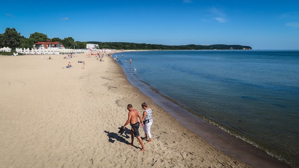 Couple walking and relaxing at the beach in Sopot, Poland 